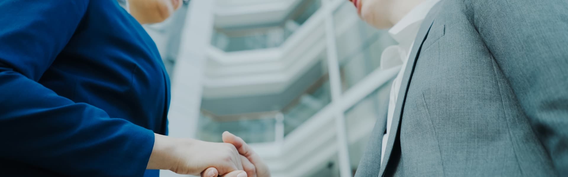 Professional handshake representing client partnership